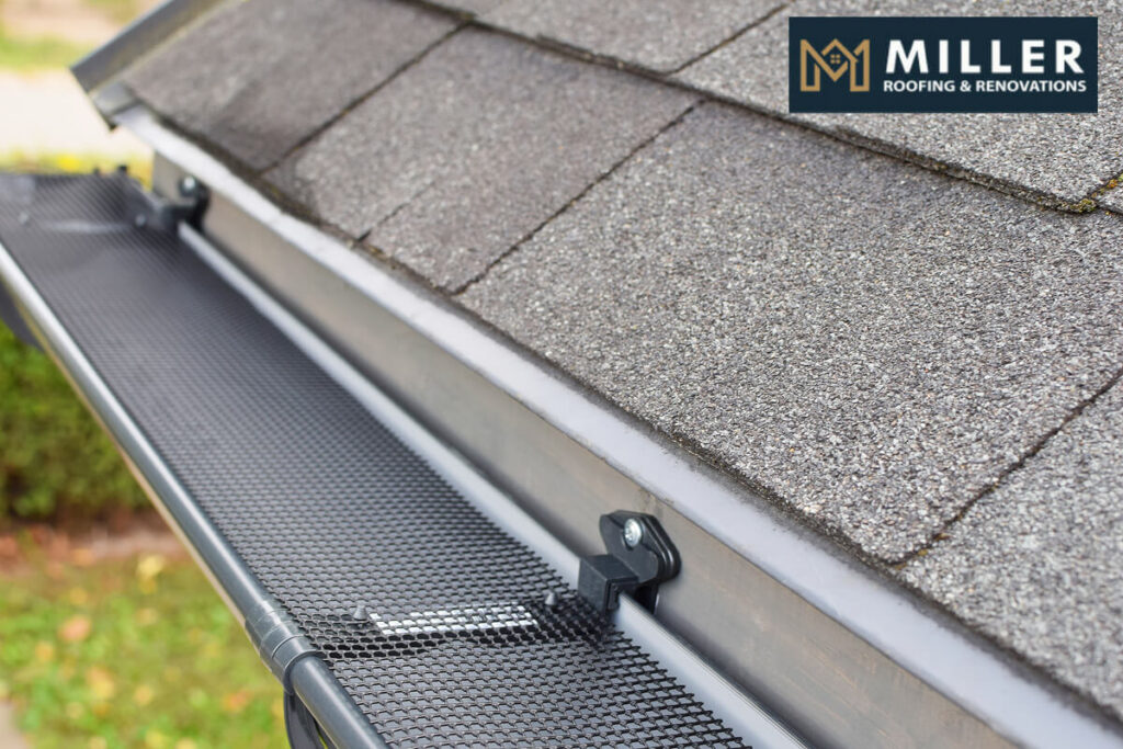 Close-up of a roof gutter with leaf guard protection system.