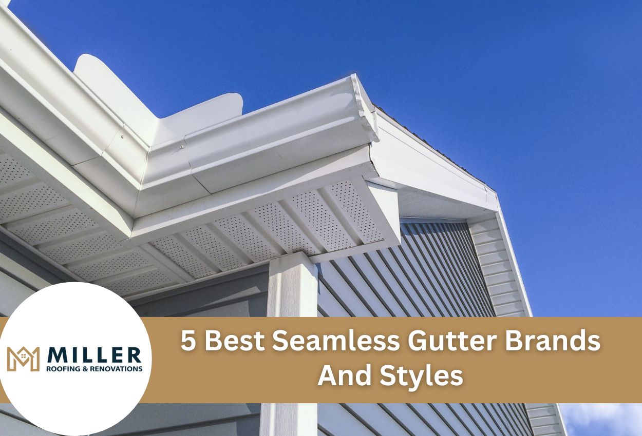 White seamless gutters on modern home exterior against bright blue sky