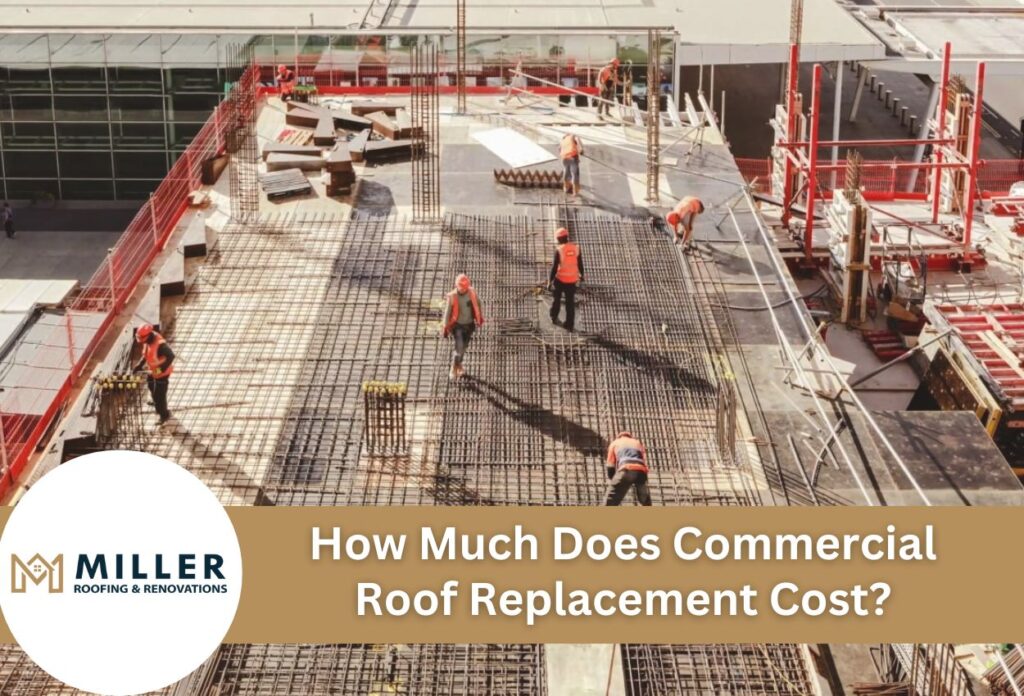 Construction workers in safety vests working on commercial roof replacement project